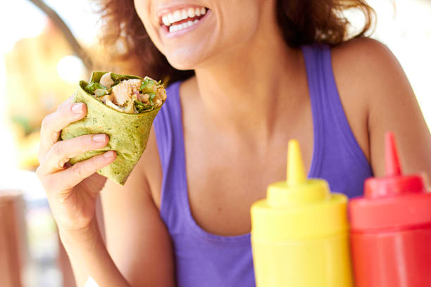 Woman Holding Chicken Wrap stock photo