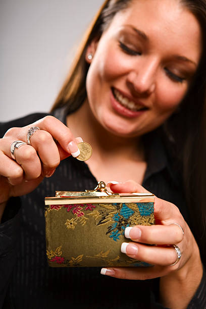 Woman holding coin purse stock photo