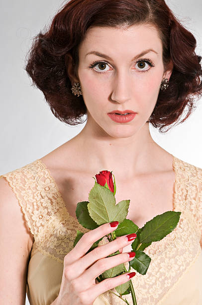 Woman holding red rose stock photo