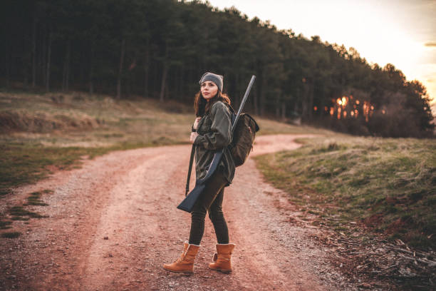 Woman hunter, looking for birds Woman hunter, looking for birds hunting sport stock pictures, royalty-free photos & images
