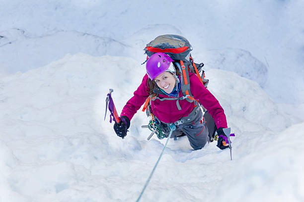 Woman Ice Climbing stock photo