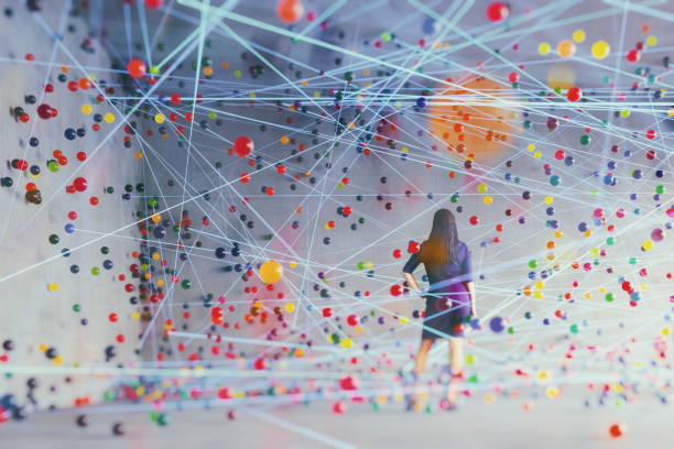 donna in una stanza di cemento con particelle astratte fluendo - sphere flying foto e immagini stock