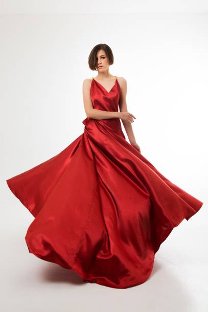 Woman in long red dress stock photo