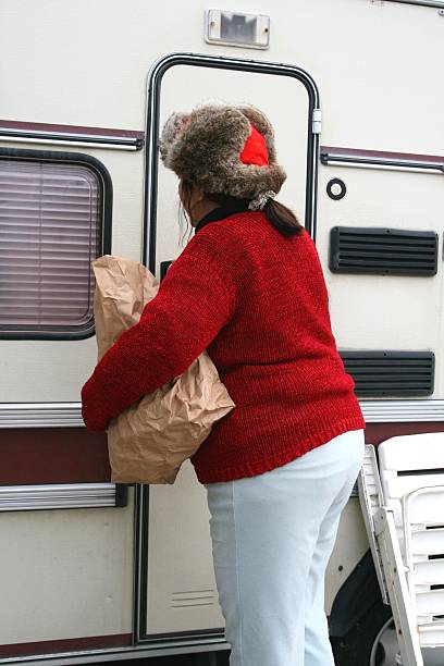 Woman living in a trailer stock photo