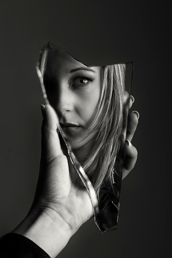 Woman Looking At Her Face In A Shard Of An Broken Mirror Artistic