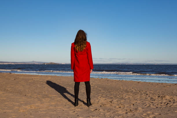 Woman on beach - Landscape stock photo