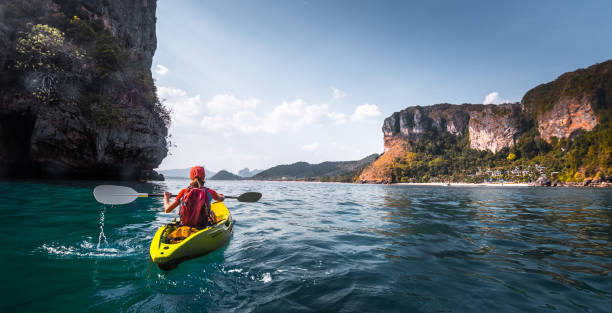 kvinna paddlar kajak - woman kayaking bildbanksfoton och bilder