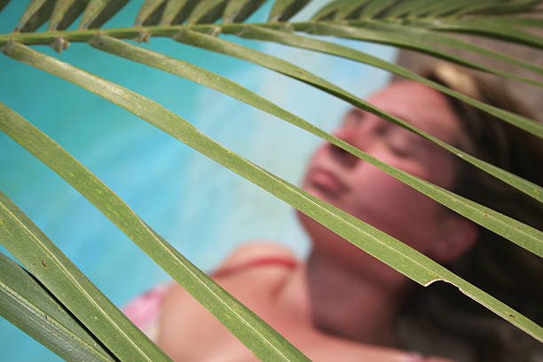 Woman Palm Frond stock photo