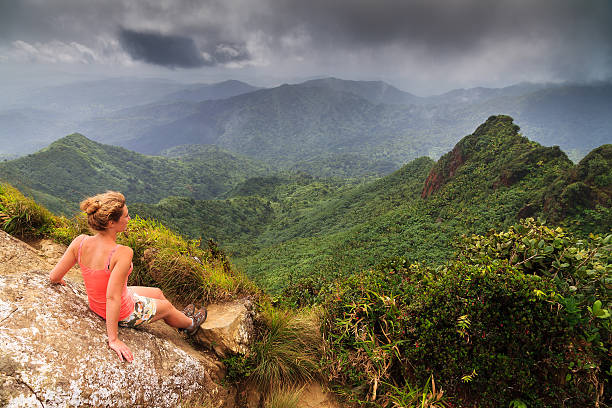 Woman panorama The Anvil Adventurous young woman on top of the beautiful jungle of the El Yunque national forest in Puerto Rico puerto rican women stock pictures, royalty-free photos & images