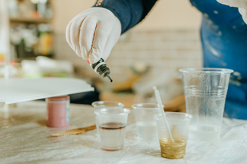 Person preparing epoxy resin