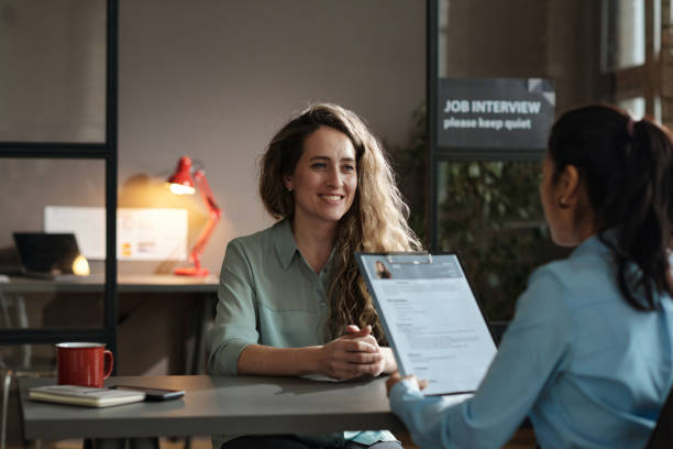 Woman presenting her resume successfully stock photo