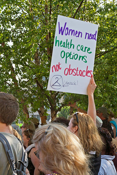 Woman Protest at Moral Monday Rally in Asheville, NC Asheville, North Carolina, USA - August 5, 2013: Woman Protest at Moral Monday Rally in Asheville, NC abortion protest stock pictures, royalty-free photos & images