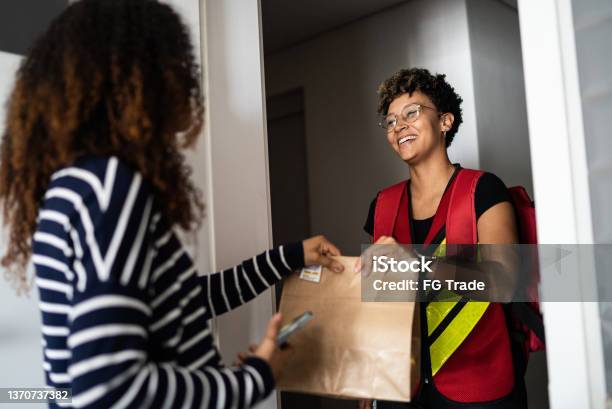 Woman receiving delivery at home