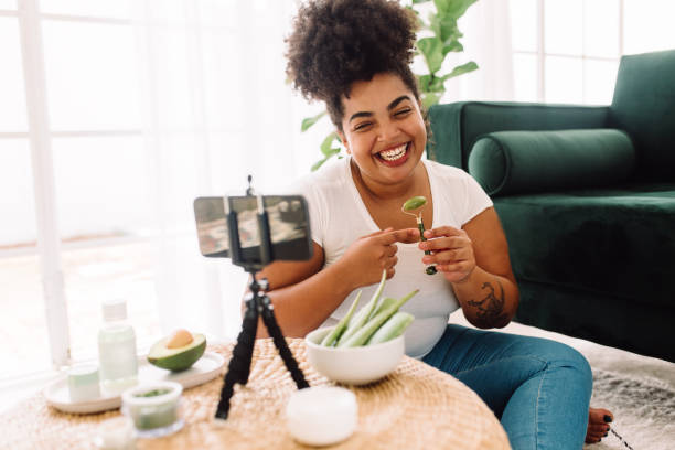 Woman recording video for health vlog stock photo
