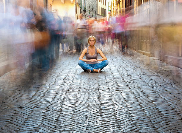Woman Relaxing in a Crowded Street stock photo