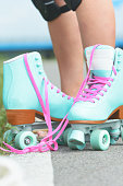istock Woman rollerskater wearing knee protector pads 1336129357