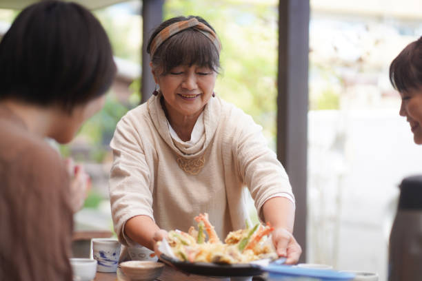 Woman serving meals stock photo