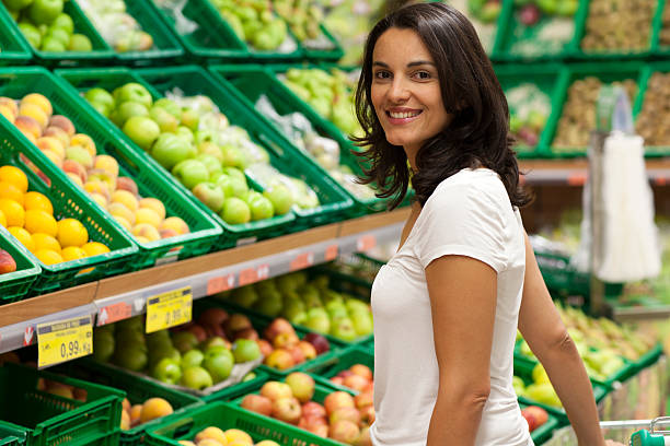 Woman shopping in supermarket stock photo