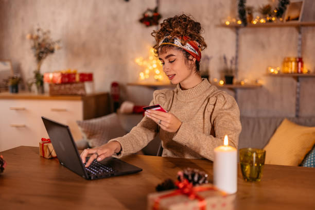Woman shopping online during Christmas stock photo