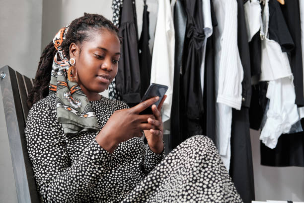 Woman shopping online on the mobile phone stock photo