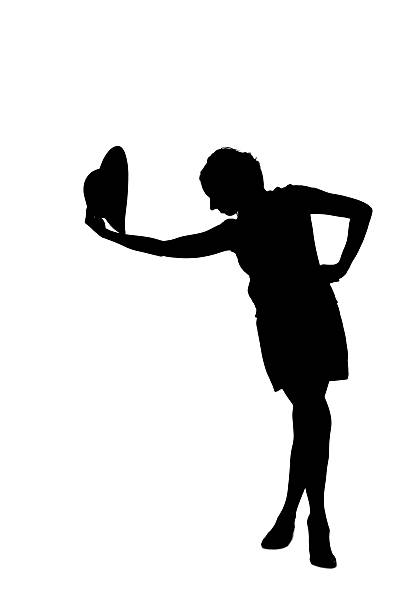 woman silhouette taking off a hat Photo of a woman silhouette taking off a hat. Taken in Riga, Latvia. hats off to you stock pictures, royalty-free photos & images