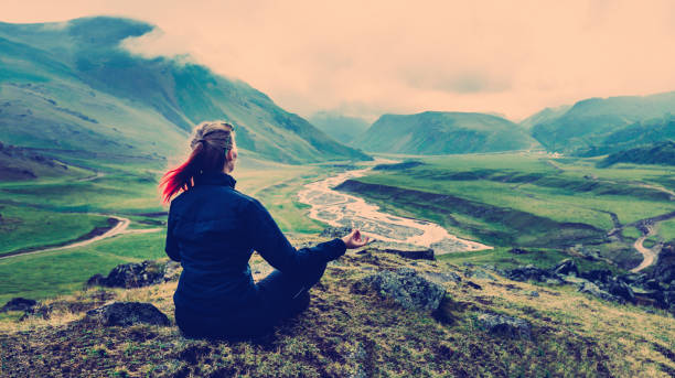 Woman Sitting On The Top And Meditates Vintage Toned Instagram Woman Sitting On The Top And Meditates Vintage Toned Instagram pranayama stock pictures, royalty-free photos & images