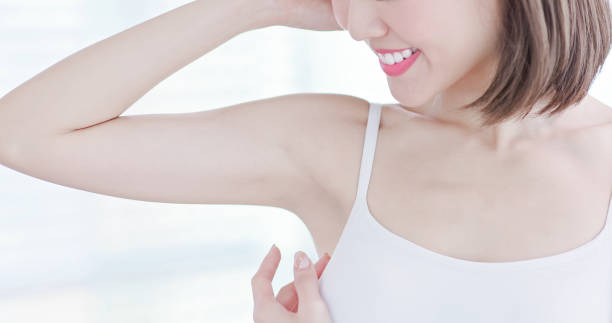 woman smile happily with armpit beauty woman smile with clean underarm - hair removal concept armpit stock pictures, royalty-free photos & images