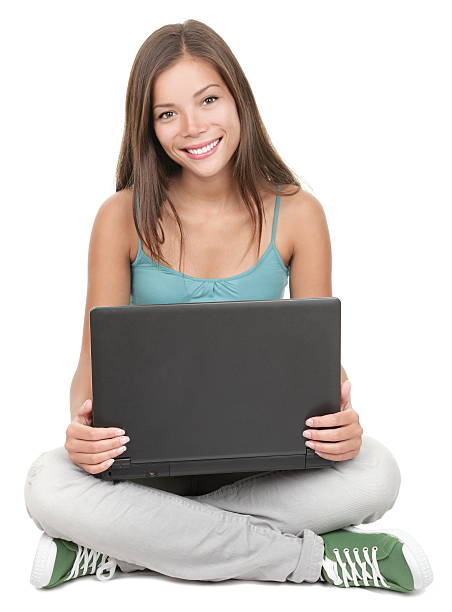 Woman student sitting with laptop isolated stock photo
