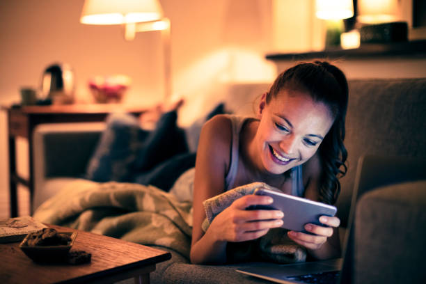 Woman using a Phone Close up of a young woman using her phone at night beautiful swedish women stock pictures, royalty-free photos & images