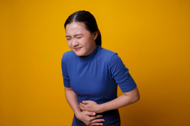 Woman was sick with stomach ache. stock photo