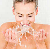 istock Woman washing her face 490800863