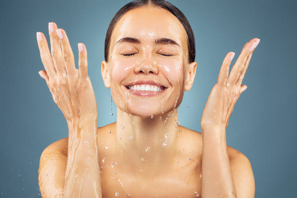 Woman washing up her face Woman washing up her face healthy skin stock pictures, royalty-free photos & images