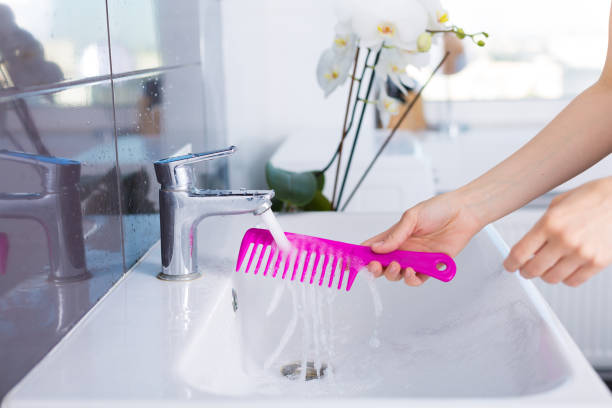 Woman washing up in the morning stock photo