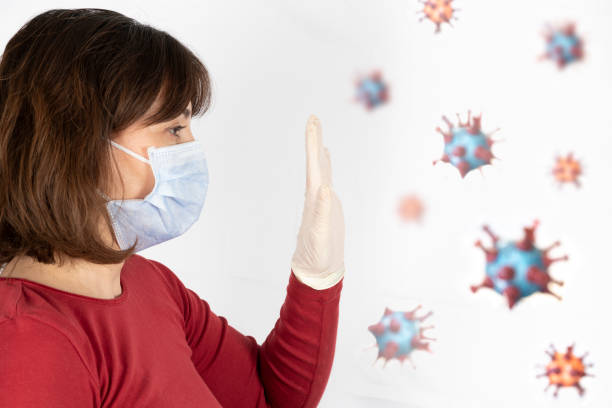 Woman wearing a mask to protect from viruses stock photo
