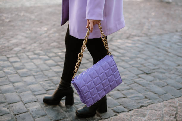 Woman wearing a purple purse stock photo