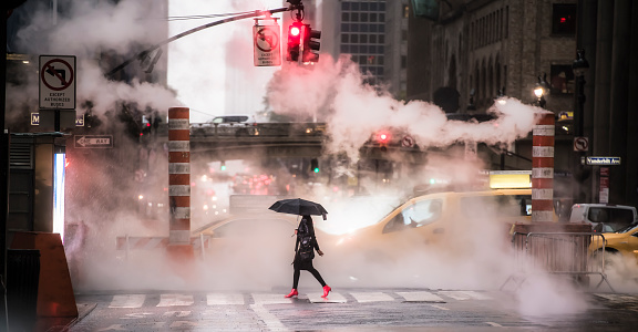 New York, USA, October 04, 2020. A woman wearing red high heels is crossing the 42nd street in Manhattan during the Covid-19 outbreak. Manhattan, New York City, United States.