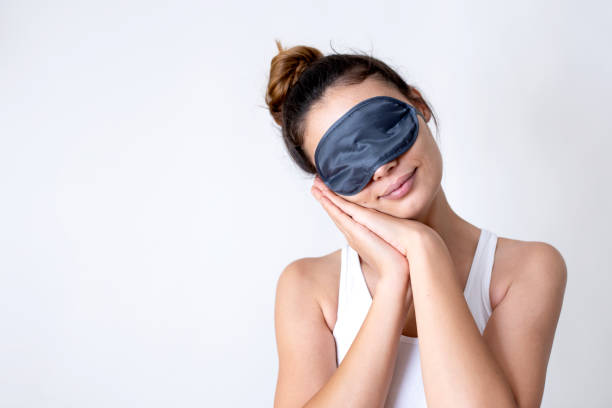 woman with eye mask sleeping woman with eye mask sleeping eye mask stock pictures, royalty-free photos & images
