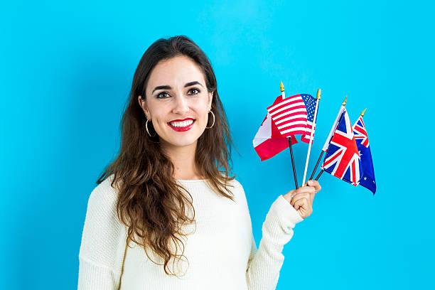 woman with flags of english speaking countries - england australia 個照片及圖片檔