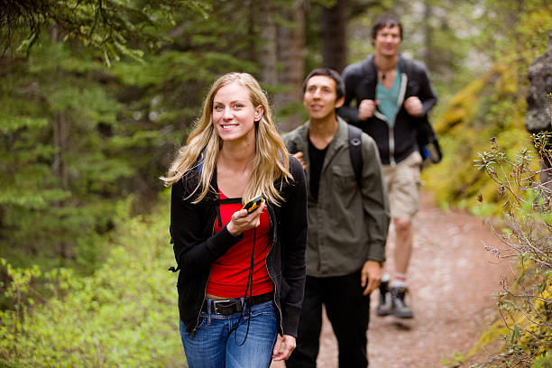 Woman with GPS in Forest stock photo