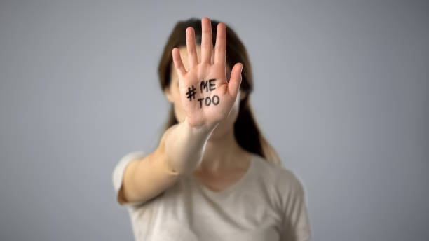 Woman with me too sign on hand, movement against sexual harassment Woman with me too sign on hand, movement against sexual harassment me too social movement stock pictures, royalty-free photos & images
