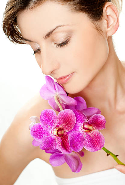 woman with orchid stock photo