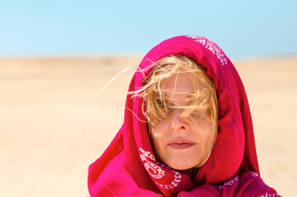 Woman with red scarf on head relax in walk on desert wind Headshot of Beautiful European Blonde Woman walking and enjoy in sand desert in Egypt hot egyptian women stock pictures, royalty-free photos & images