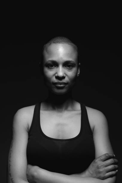 Woman with shaved hair B&W stock photo