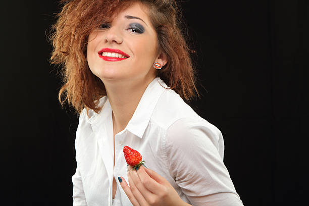 Woman with strawberry stock photo