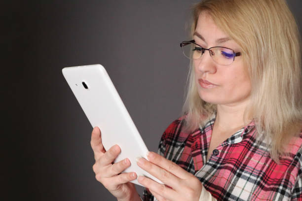 Woman with tablet stock photo