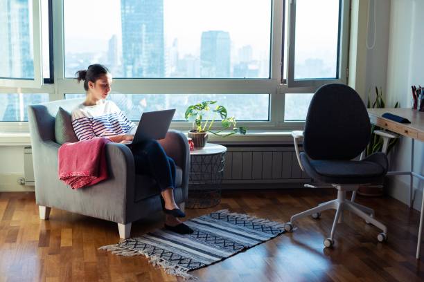 Woman working from home stock photo