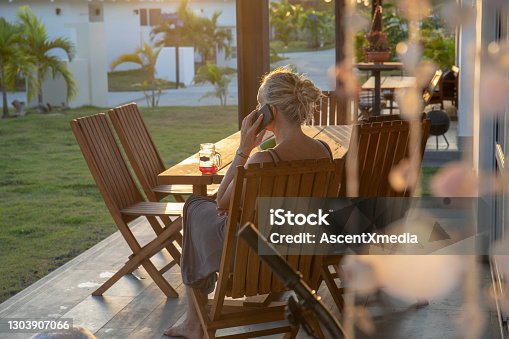 istock Woman works from home on outdoor patio in the morning 1303907066