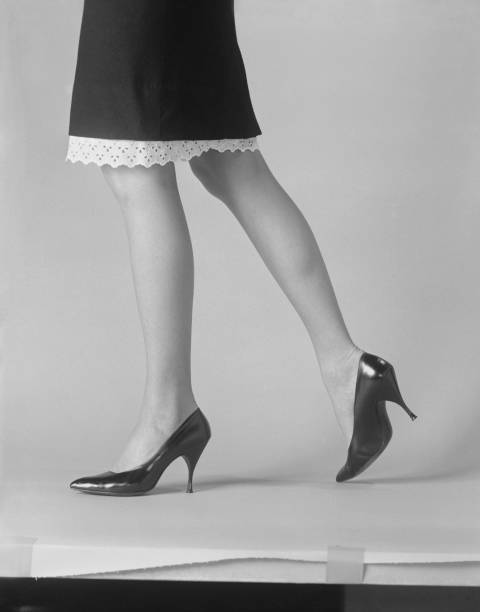 Woman's leg with high heels on white background  1964 stock pictures, royalty-free photos & images