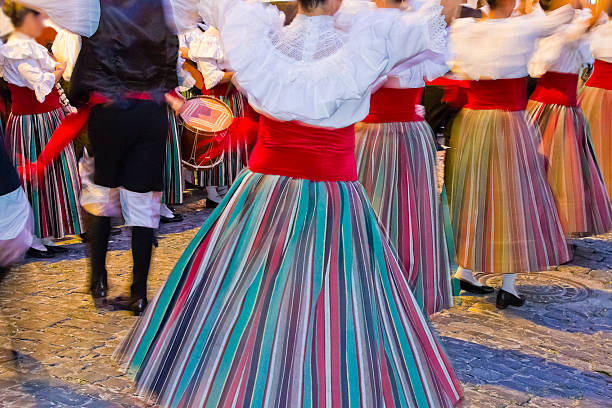 Women dancing in traditional clothing for a celebration stock photo