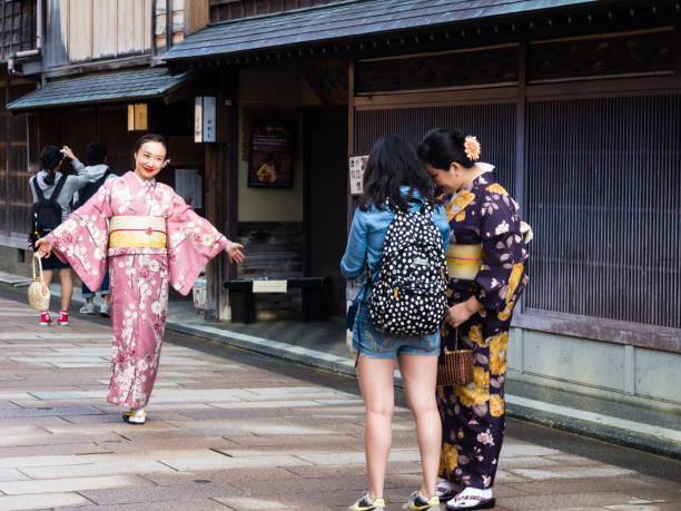 Women in kimono in historic district of Kanazawa, Japan stock photo